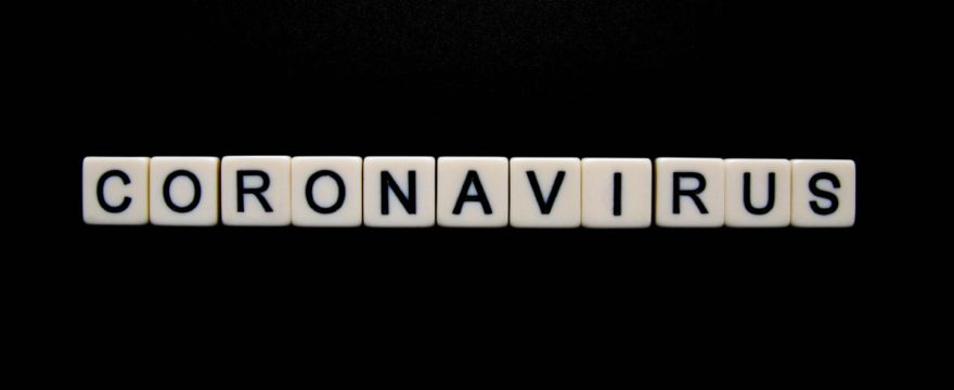 coronavirus spelled out in Scrabble letters