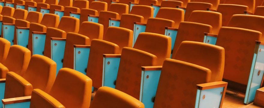 debating chamber with orange chairs